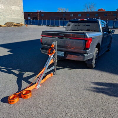 HitchRail connected to pickup truck hitch with straps ready to be deployed.